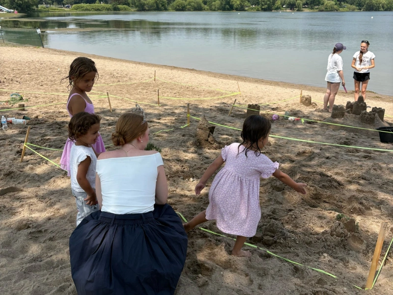 Families attending outdoor event at lake