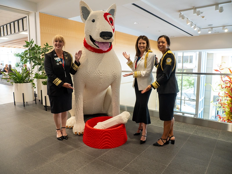 Community group posing with mascot